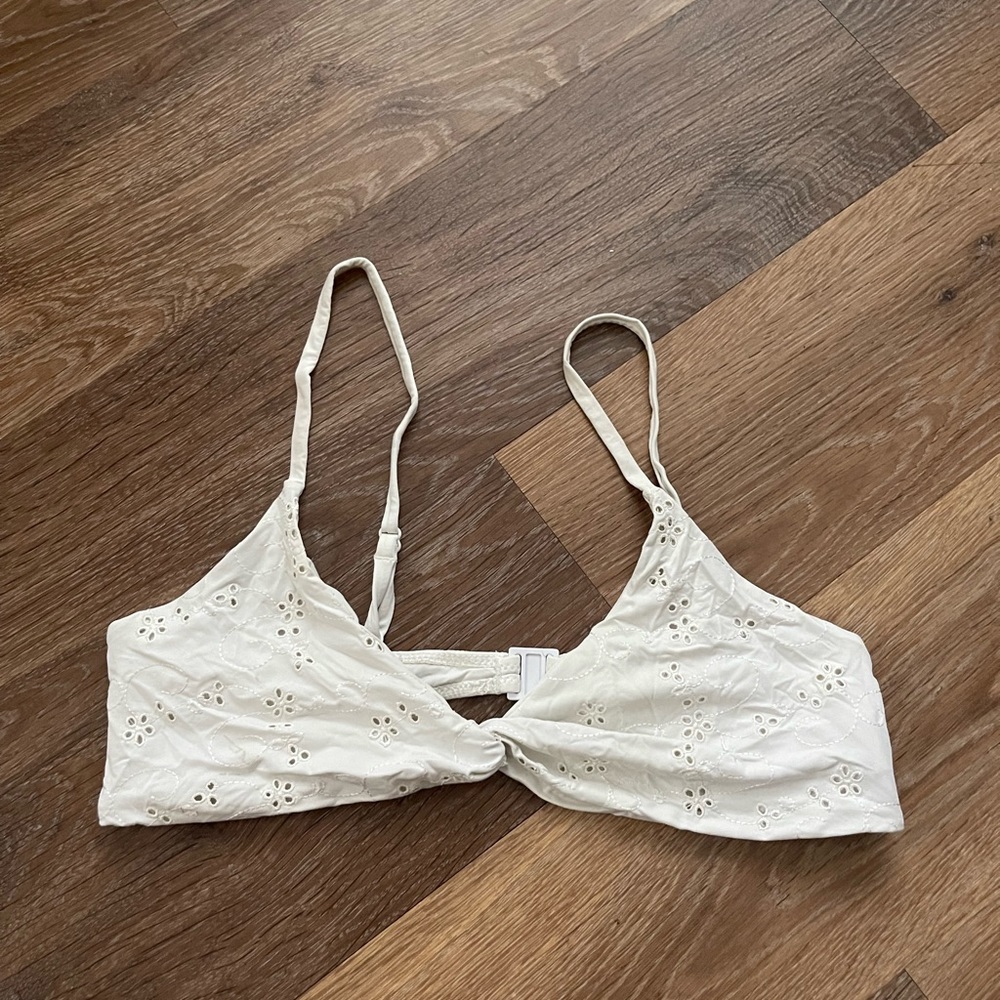 Cute white floral blackbough swim top.